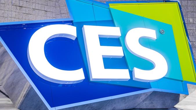 The CES logo outside the Las Vegas Convention Center. The CES letters are white, and the background colors are lime green and multiple shades of blue.
